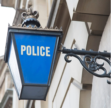 Traditional blue Police station lamp mounted on a wall