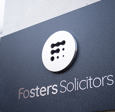 Fosters Solicitors wall-mounted sign at the office entrance