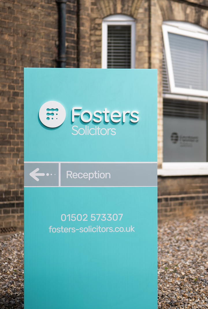 Fosters Solicitors reception signage board with directions and contact details at the Lowestoft office