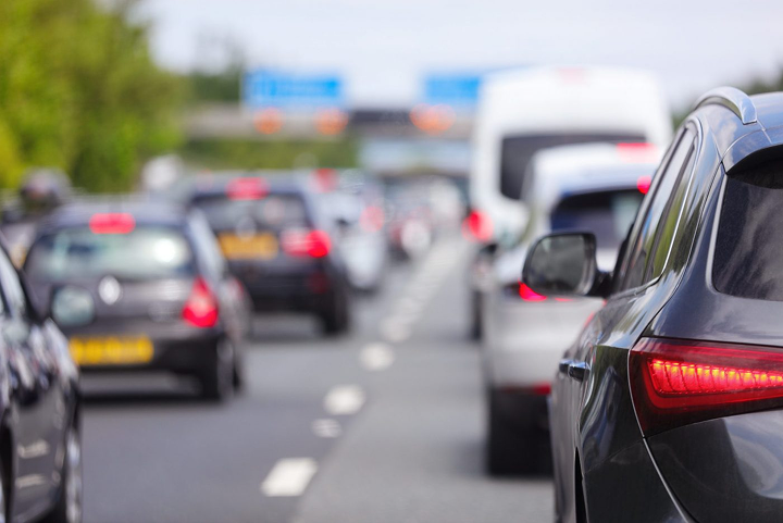 Queue of traffic on a motorway with cars braking