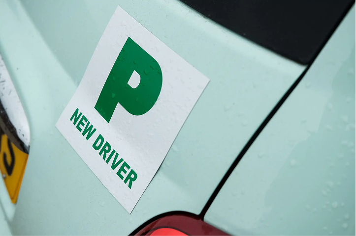 Green 'P' new driver plate displayed on the rear of a car