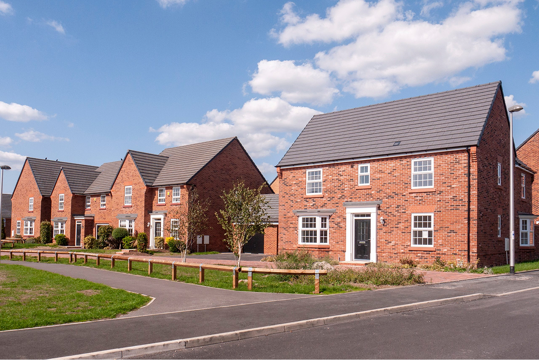 Row of new-build brick houses on a modern housing development
